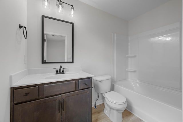174 Oak St, Clarksville, TN 37042 - full bath with vanity, toilet, wood finished floors, shower / washtub combination, and baseboards