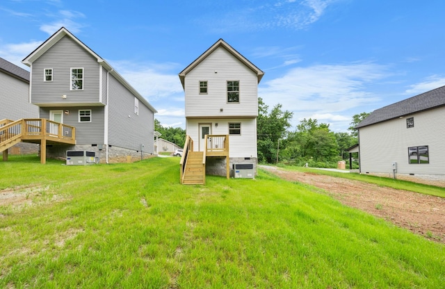 174 Oak St, Clarksville, TN 37042 - rear view of property featuring stairway, a deck, a yard, and central AC