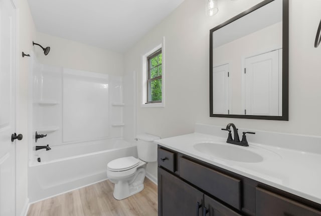 174 Oak St, Clarksville, TN 37042 - full bathroom with vanity, toilet, wood finished floors, bathing tub / shower combination, and baseboards