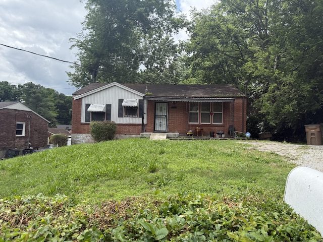 3205 Holland Ln, Nashville, TN 37218 - view of front facade featuring brick siding and a front lawn