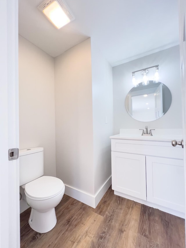 2513 Hickory Dr, Springfield, TN 37172 - bathroom featuring vanity, toilet, wood finished floors, and baseboards