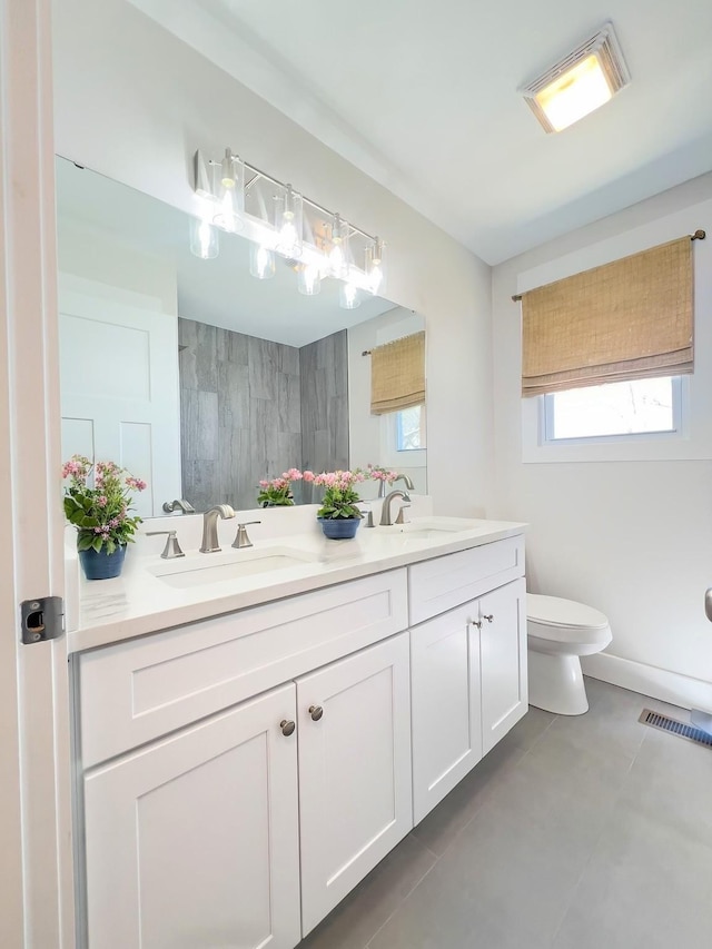 2513 Hickory Dr, Springfield, TN 37172 - full bathroom featuring double vanity, toilet, tile patterned floors, and a shower