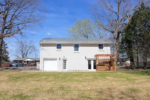 2513 Hickory Dr, Springfield, TN 37172 - back of property featuring an attached garage, brick siding, and a pergola