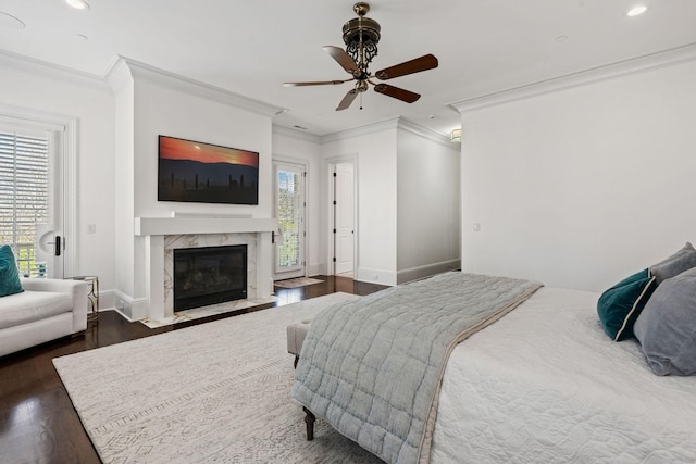 100 Church St, Franklin, TN 37064 - bedroom featuring crown molding, multiple windows, dark wood finished floors, a premium fireplace, and baseboards