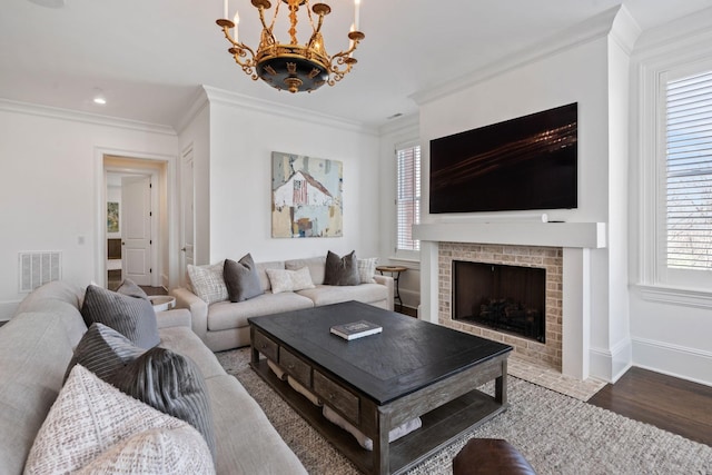 100 Church St, Franklin, TN 37064 - living area with a fireplace, crown molding, plenty of natural light, a chandelier, and baseboards