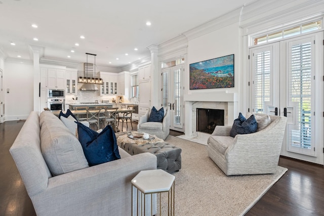 100 Church St, Franklin, TN 37064 - living room with french doors, crown molding, dark wood-type flooring, a fireplace, and recessed lighting