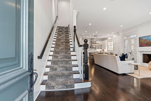 100 Church St, Franklin, TN 37064 - stairs featuring ornamental molding, wood finished floors, recessed lighting, and a fireplace