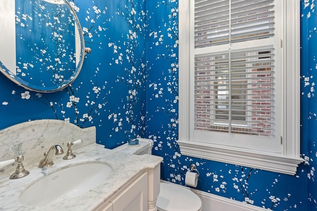 100 Church St, Franklin, TN 37064 - half bathroom with toilet, vanity, and wallpapered walls
