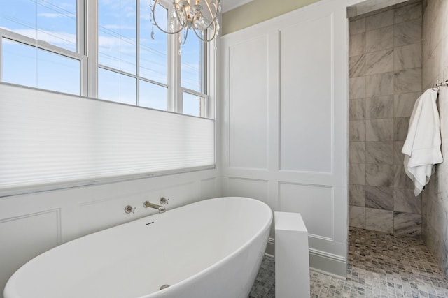 100 Church St, Franklin, TN 37064 - full bathroom featuring a decorative wall, healthy amount of natural light, a freestanding tub, a chandelier, and tiled shower