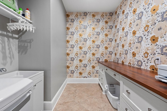 100 Church St, Franklin, TN 37064 - laundry area with wallpapered walls, washing machine and clothes dryer, baseboards, and light tile patterned floors