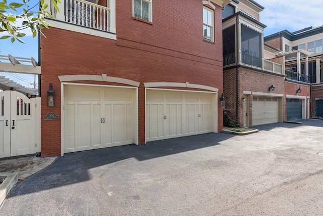 100 Church St, Franklin, TN 37064 - view of home's exterior featuring an attached garage and brick siding