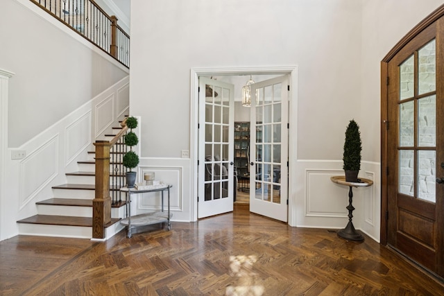 2433 Durham Manor Dr, Franklin, TN 37064 - foyer featuring a decorative wall, french doors, stairs, plenty of natural light, and a chandelier