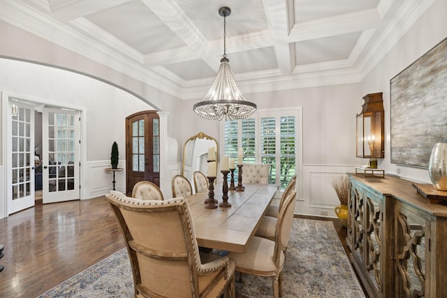 2433 Durham Manor Dr, Franklin, TN 37064 - dining area featuring french doors, arched walkways, a chandelier, a decorative wall, and wood finished floors