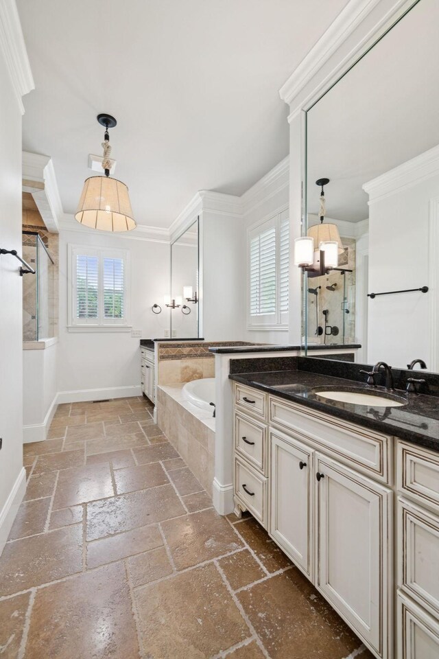 2433 Durham Manor Dr, Franklin, TN 37064 - full bath featuring stone tile floors, a garden tub, vanity, ornamental molding, and baseboards
