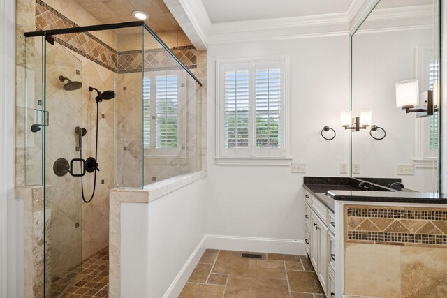 2433 Durham Manor Dr, Franklin, TN 37064 - full bathroom featuring ornamental molding, baseboards, vanity, a stall shower, and stone tile flooring