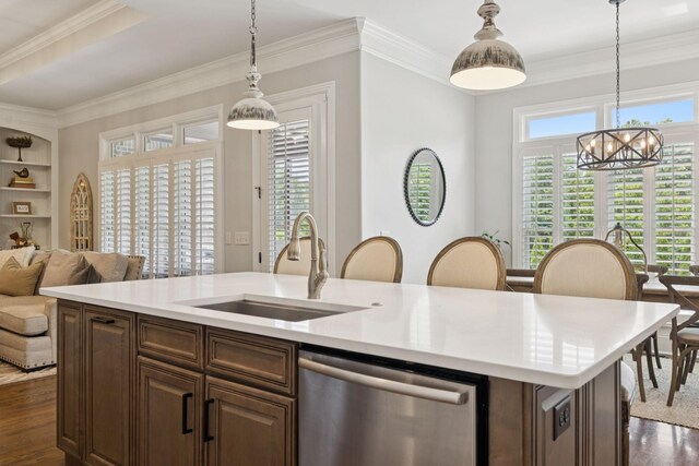 2433 Durham Manor Dr, Franklin, TN 37064 - kitchen featuring stainless steel dishwasher, a sink, dark wood-style floors, a chandelier, and light countertops