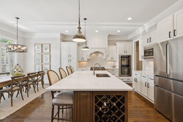 2433 Durham Manor Dr, Franklin, TN 37064 - kitchen featuring appliances with stainless steel finishes, dark wood finished floors, a sink, light countertops, and recessed lighting