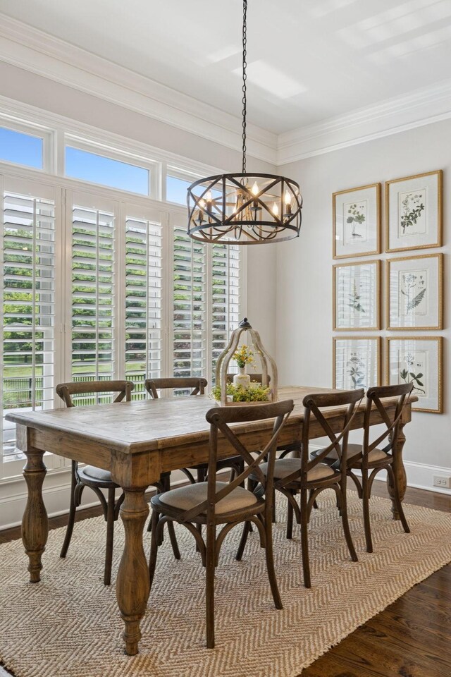 2433 Durham Manor Dr, Franklin, TN 37064 - dining area featuring a chandelier, ornamental molding, and dark wood-style floors