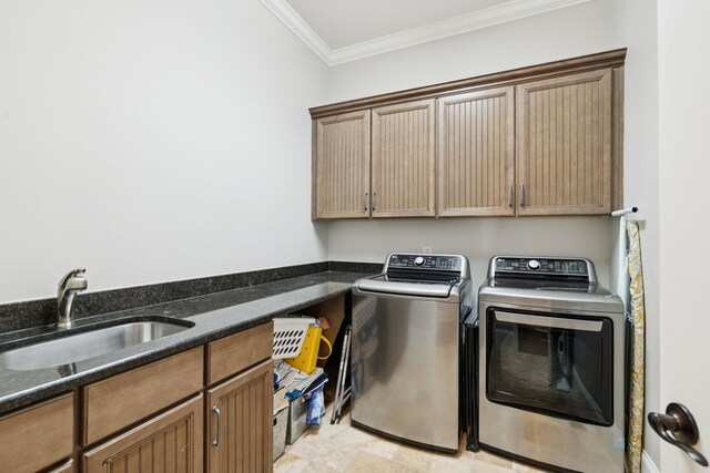 2433 Durham Manor Dr, Franklin, TN 37064 - laundry area featuring cabinet space, washer and dryer, ornamental molding, and light stone finish flooring