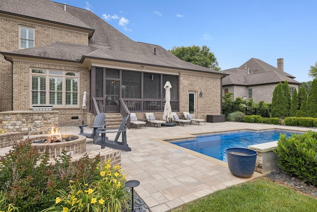 2433 Durham Manor Dr, Franklin, TN 37064 - swimming pool with a fire pit, a sunroom, and a patio