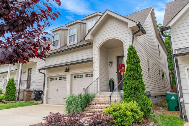 5540 Knob Rd, Nashville, TN 37209 - view of front facade featuring an attached garage, a shingled roof, and concrete driveway