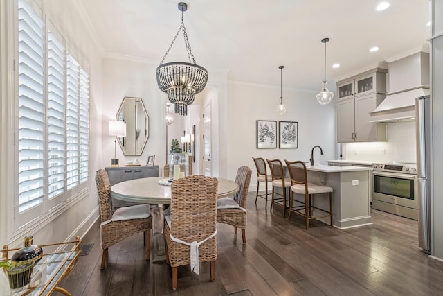 5540 Knob Rd, Nashville, TN 37209 - dining area with a chandelier, dark wood-style floors, ornamental molding, and recessed lighting