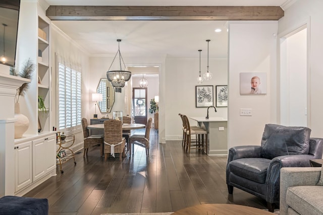 5540 Knob Rd, Nashville, TN 37209 - dining room with a chandelier, dark wood-style floors, healthy amount of natural light, crown molding, and baseboards