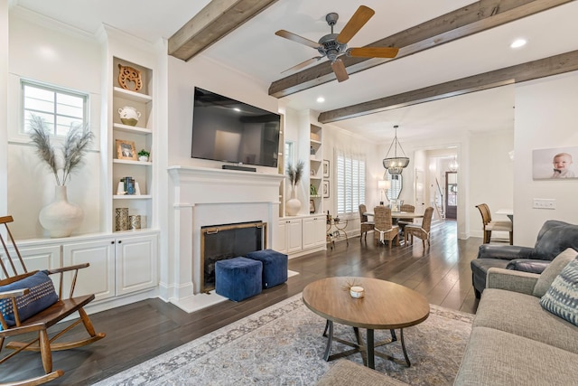 5540 Knob Rd, Nashville, TN 37209 - living area featuring dark wood-style floors, beamed ceiling, plenty of natural light, ceiling fan, and built in features