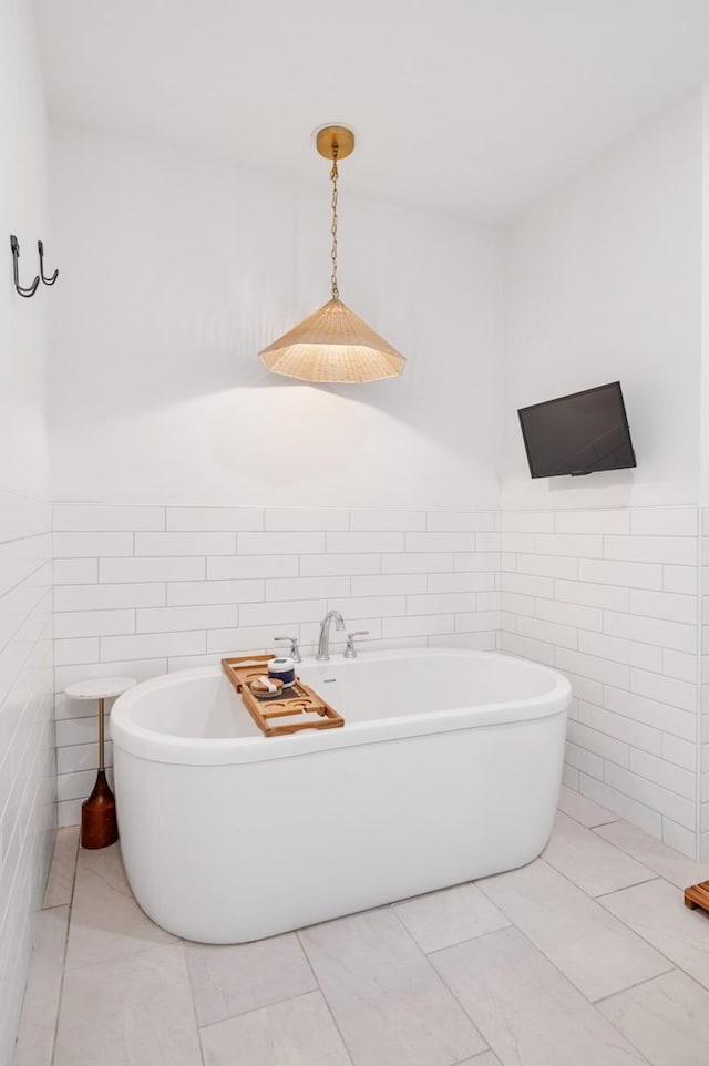 4042 Flowing Creek Dr, Franklin, TN 37064 - full bath with tile walls, a freestanding tub, and wainscoting
