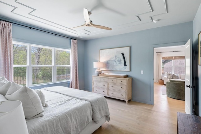 4042 Flowing Creek Dr, Franklin, TN 37064 - bedroom with attic access, multiple windows, light wood-type flooring, and a ceiling fan