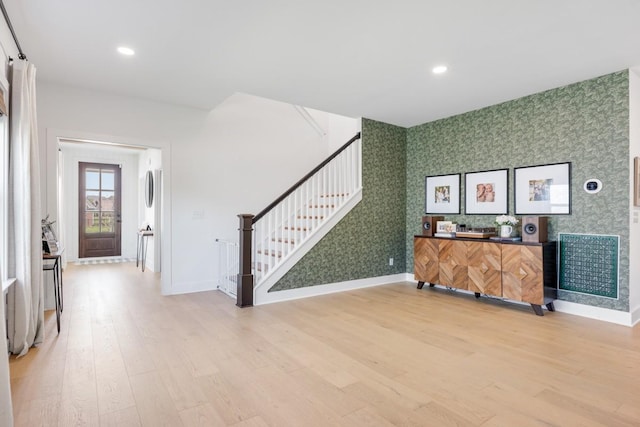 4042 Flowing Creek Dr, Franklin, TN 37064 - unfurnished living room with wallpapered walls, light wood-style flooring, stairway, baseboards, and recessed lighting