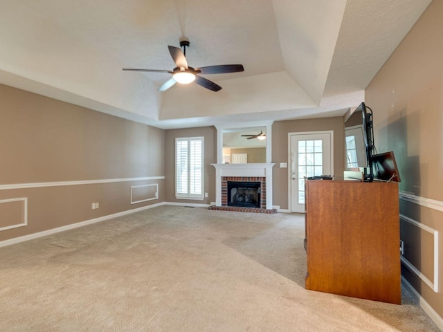 2999 Cages Bend Rd, Gallatin, TN 37066 - unfurnished living room featuring a raised ceiling, ceiling fan, healthy amount of natural light, and carpet floors