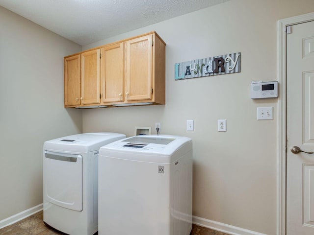 2999 Cages Bend Rd, Gallatin, TN 37066 - laundry area with cabinet space, washer and clothes dryer, and baseboards