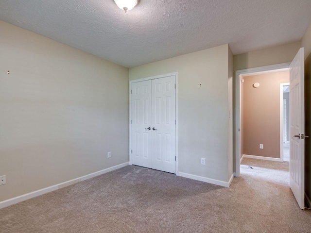 2999 Cages Bend Rd, Gallatin, TN 37066 - unfurnished bedroom with a closet, a textured ceiling, carpet, and baseboards