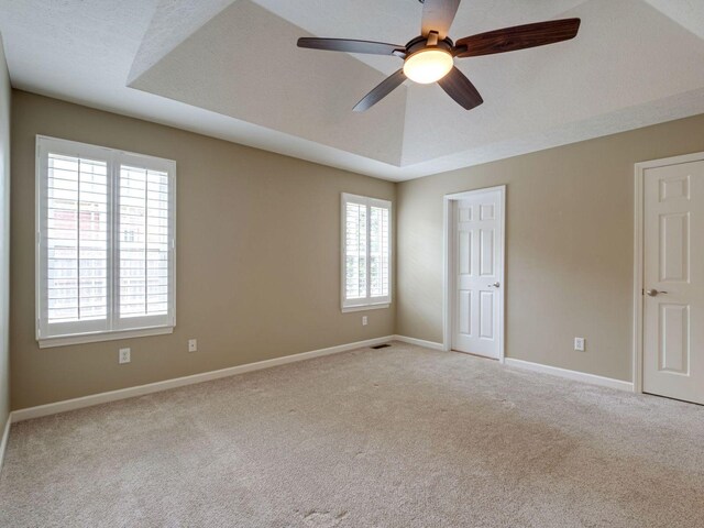 2999 Cages Bend Rd, Gallatin, TN 37066 - unfurnished bedroom featuring light carpet, baseboards, and a ceiling fan