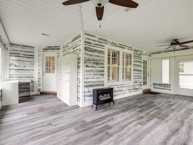2999 Cages Bend Rd, Gallatin, TN 37066 - unfurnished sunroom with a wood stove and healthy amount of natural light