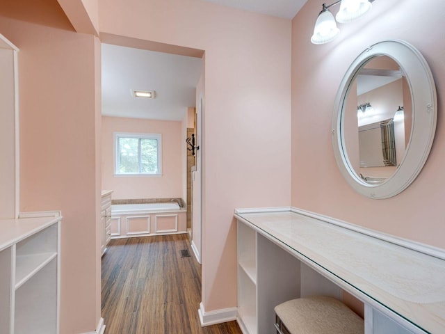2999 Cages Bend Rd, Gallatin, TN 37066 - bathroom with a garden tub, wood finished floors, baseboards, and vanity