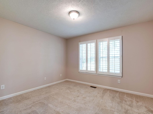 2999 Cages Bend Rd, Gallatin, TN 37066 - unfurnished room with carpet floors, baseboards, and a textured ceiling
