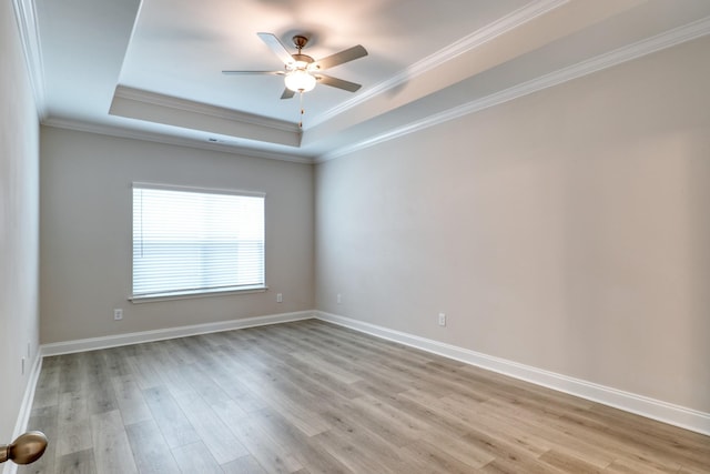 3254 Tasker Dr, Antioch, TN 37013 - spare room with a tray ceiling, ceiling fan, light wood-style floors, crown molding, and baseboards