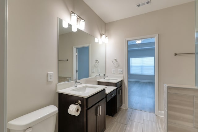 3254 Tasker Dr, Antioch, TN 37013 - bathroom featuring vanity, toilet, and baseboards