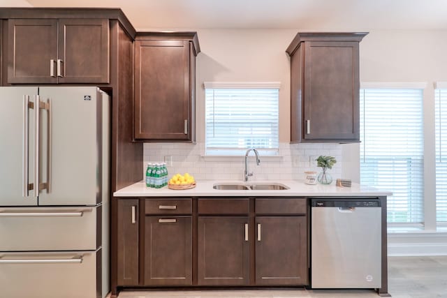3254 Tasker Dr, Antioch, TN 37013 - kitchen featuring appliances with stainless steel finishes, a sink, dark brown cabinets, and light countertops