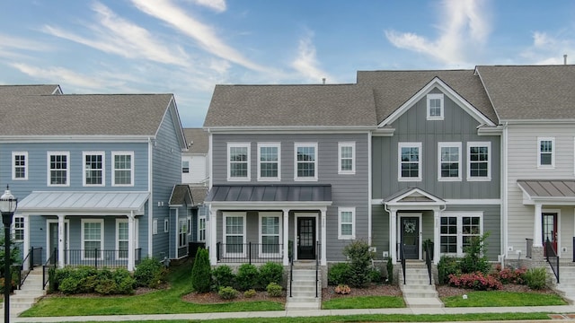 3254 Tasker Dr, Antioch, TN 37013 - townhome / multi-family property featuring covered porch, board and batten siding, a standing seam roof, and metal roof