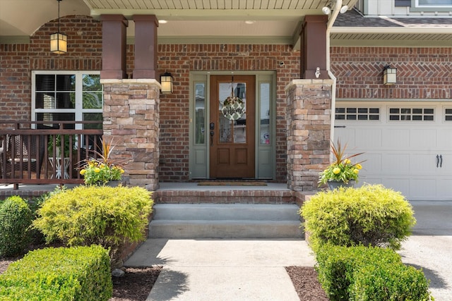 441 Highpoint Ter, Brentwood, TN 37027 - property entrance featuring brick siding, an attached garage, and covered porch