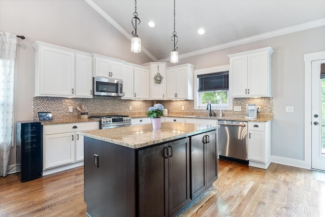 441 Highpoint Ter, Brentwood, TN 37027 - kitchen with appliances with stainless steel finishes, a sink, crown molding, white cabinetry, and decorative backsplash