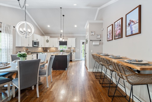 441 Highpoint Ter, Brentwood, TN 37027 - dining room with ornamental molding, vaulted ceiling, a chandelier, wood finished floors, and baseboards