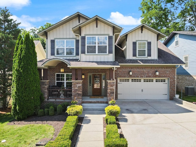 441 Highpoint Ter, Brentwood, TN 37027 - view of front facade with board and batten siding, central AC, concrete driveway, a porch, and brick siding
