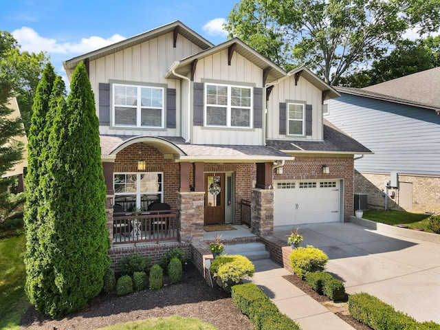 441 Highpoint Ter, Brentwood, TN 37027 - view of front of home with covered porch, a garage, concrete driveway, board and batten siding, and roof with shingles