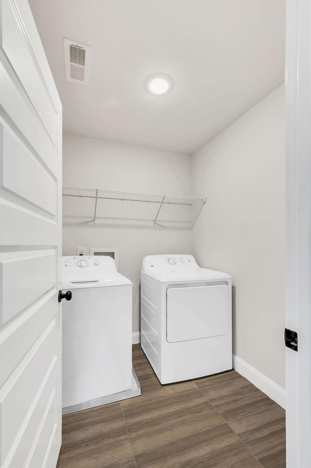2734 Lakeland Dr, Nashville, TN 37214 - washroom with washer and clothes dryer, baseboards, and dark wood-style floors