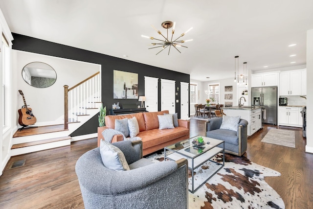2734 Lakeland Dr, Nashville, TN 37214 - living area with a chandelier, stairs, dark wood-type flooring, and recessed lighting