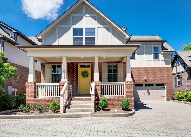 2734 Lakeland Dr, Nashville, TN 37214 - view of front of home with brick siding, a porch, and decorative driveway